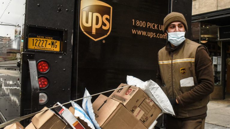 Shares of UPS fall after firm says greater charges in Q2 offset lower-than-expected volumes