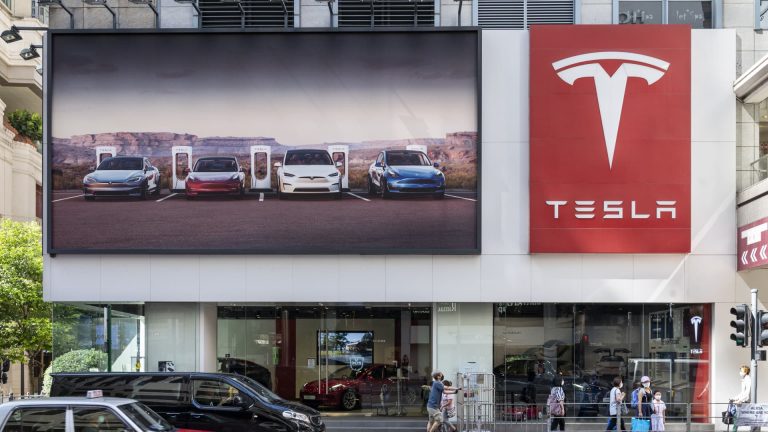 Tesla value cuts speed up EV market’s first recession stress check